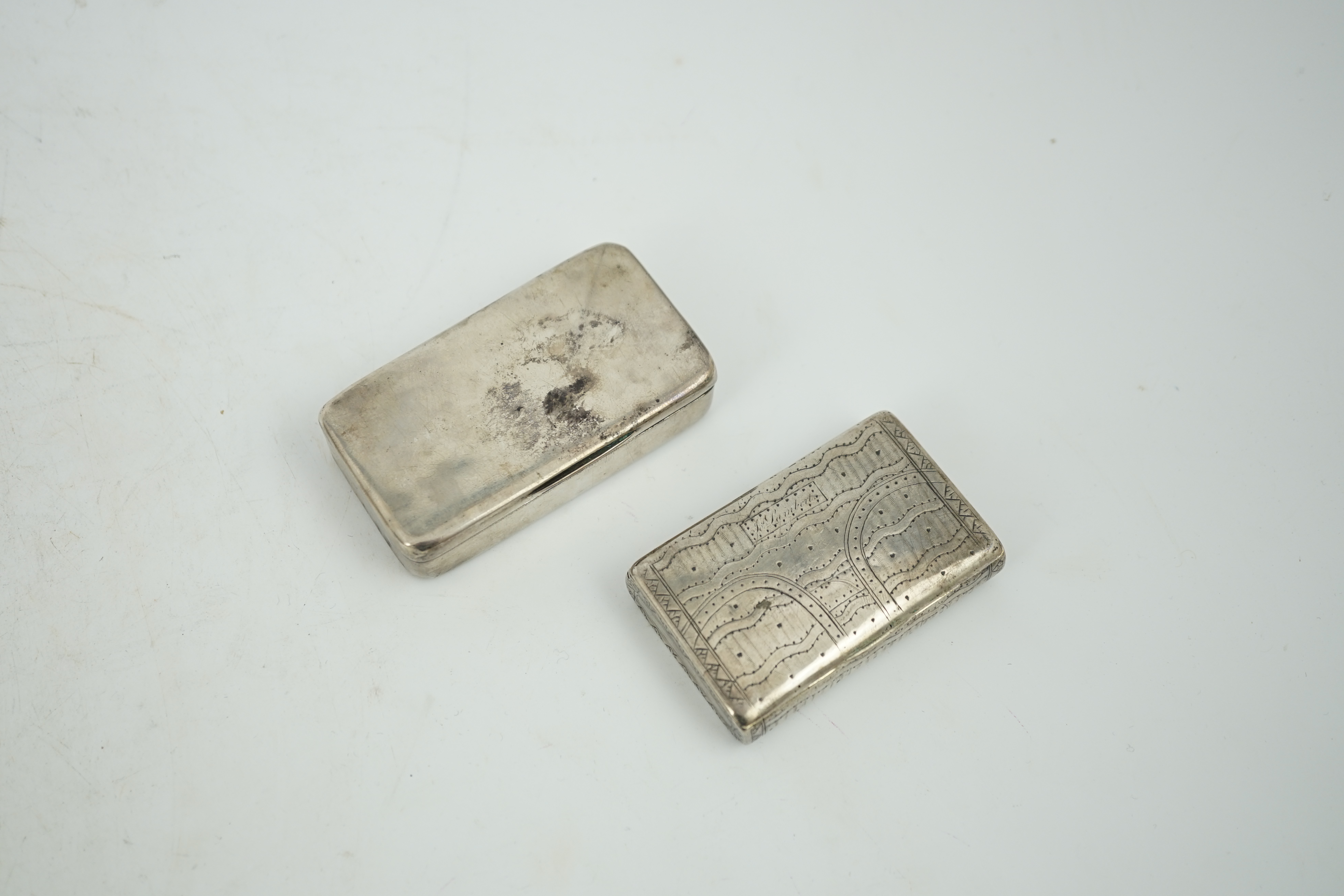 A George III silver snuff box, maker's mark rubbed, London, 1807, 74mm, together with an early 19th century Russian 84 zolotnik snuff box, dated 1819, 64mm.